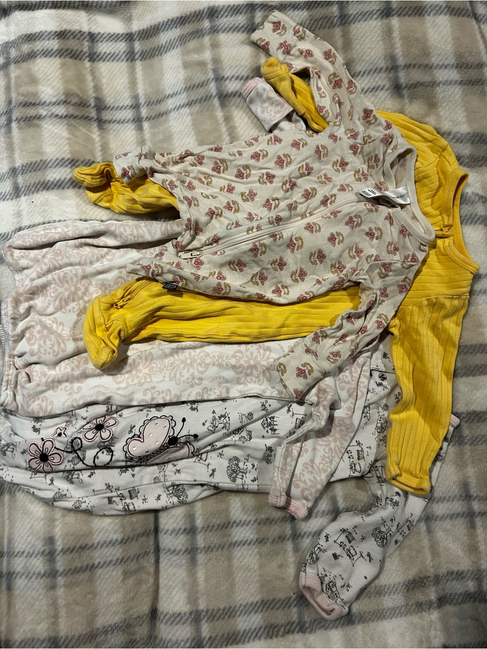 sleep bundle, two sleep sacks and two onesies. sizes range from newborn - 6m